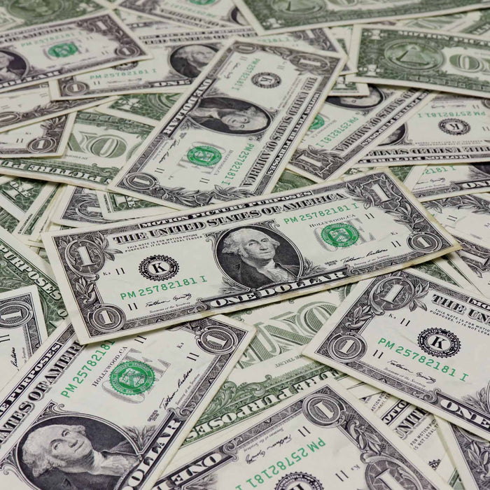 Aged $1 prop money stack with 100 full print bills