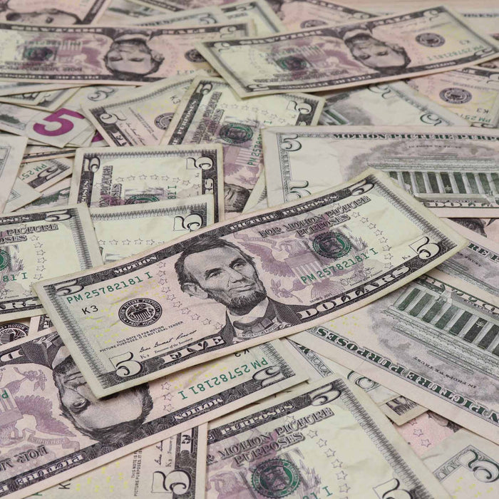 Realistic aged $5 prop money bills for film and photography